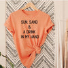 Sun, Sand And A Drink In My Hand tee in sunset orange with black lettering